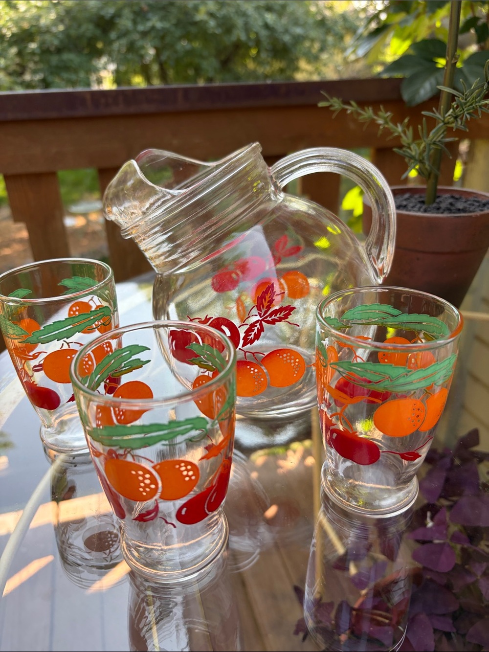 Vintage Anchor Hocking slanted ball, pitcher, and three glasses.